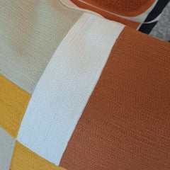 Close-up of the Abstra Embroidered Cushion featuring vibrant colors and detailed texture in a soft cotton fabric.