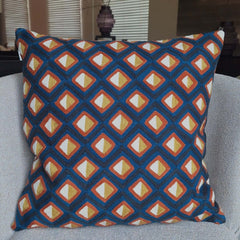 Adama Embroidered Cushion with colorful geometric pattern showcasing detailed stitching and vibrant textures.