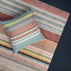 Margo Selby Algarve Square Cushion on a carpet