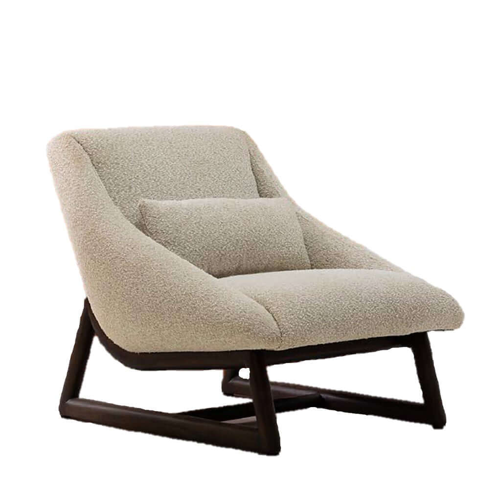 An armless chair with a solid wood base in a dark finish and beige fabric upholstery.