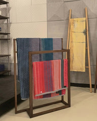 A walnut Belut Hanger 2-Tier with a simple straight-line silhouette, intended for drying towels or hanging clothing.