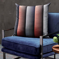 Margo Selby Blaze Square Cushion on an armchair