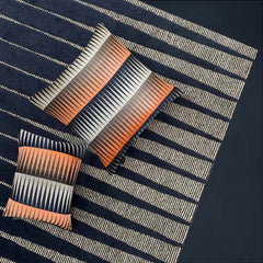 Margo Selby Blaze Rectangle Cushion on a rug
