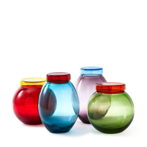 A set of four inflated, curvy glass jars in red, blue, purple, and green colors, by Pols Potten
