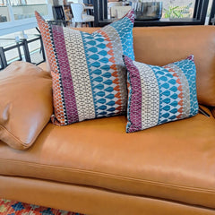 Margo Selby Calypso Square Cushion on a leather sofa