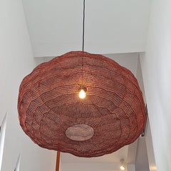Handwoven pendant light made of copper wire mesh in copper finish