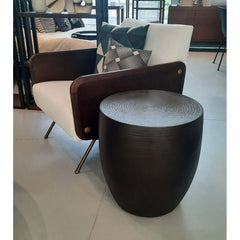 A drum-shaped aluminium Congo Side Table with a bronze finish.