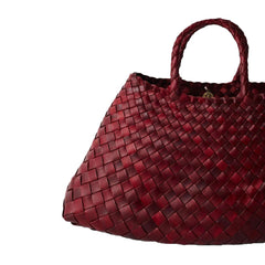 Dragon Diffusion Santa Croce Small Bordo with asymmetric leather straps and a woven basket-like design.