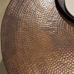 A unique Drum Coffee Table with hammered patterns, finished in oil brass matt