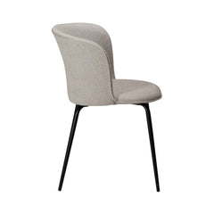 An off white fabric upholstered dining chair with a curved backrest and straight, conical metal legs.