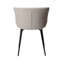 An off white fabric upholstered dining chair with a curved backrest and straight, conical metal legs.