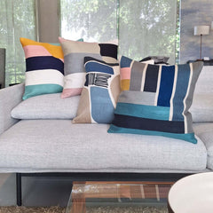 Embroidered Cushion collection on a modern sofa, showcasing vibrant colors and unique patterns in 45x45cm size.