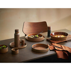 A round, brown stoneware Form Art dinnerware with a matte finish and a visible brown glaze, by ASA selection