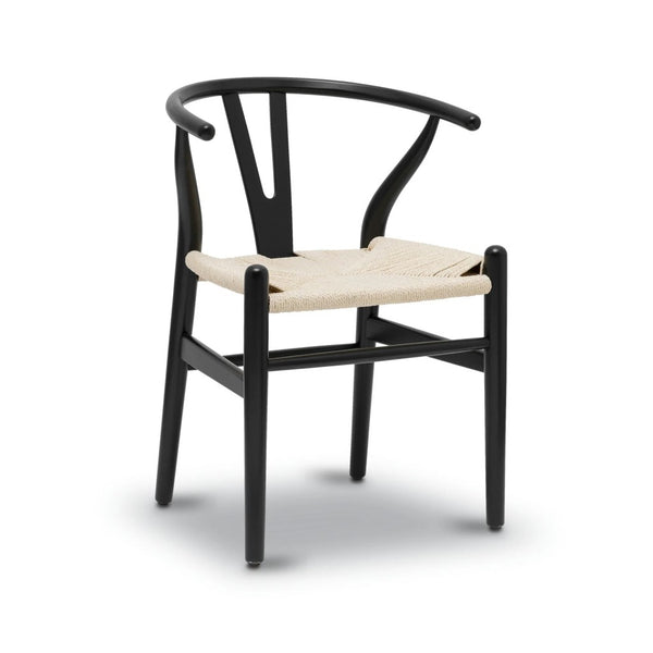 A black dining chair with a hard backrest and a natural finish rope seat.
