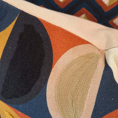 Close-up of Hemi Embroidered Cushion showcasing vibrant colors and intricate stitching details.