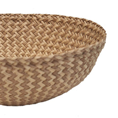 Close-up of a handmade Iraca Small Bowl Zigzag Toasted basket with a zigzag pattern, made in Columbia 