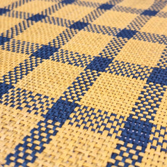 Close up of a Iraca Rectangle Placemat Blue Yellow handmade in colombia
