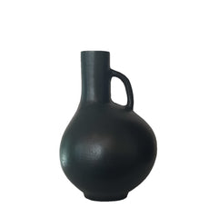 Jug Shaped Aluminium Vase 33cm Blackish Bronze is suitable for use as a decorative piece on a shelf or tabletop.