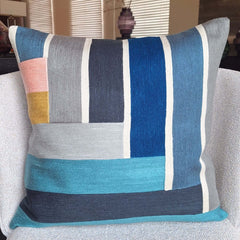 Keano Embroidered Cushion showcasing vibrant colors and intricate stitching details.