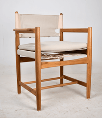 Teak Kenya Armchair Cotton Canvas in sand colour cushioned seat and backrest. The seat is supported with saddle leather belt with brass buckle.