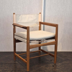 Teak Kenya Armchair Cotton Canvas in sand colour cushioned seat and backrest. The seat is supported with saddle leather belt with brass buckle.