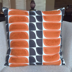 Kivi Embroidered Cushion featuring vibrant patterns and textures in warm tones, perfect for adding style to your home decor.