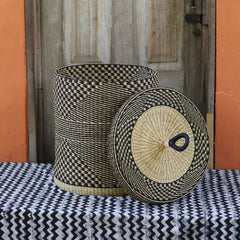 Baba Tree Handwoven Lidded Laundry Basket 00024 with black and natural pattern made of elephant grass in Ghana