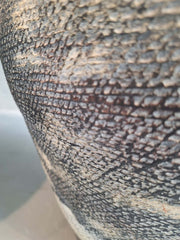 Close-up of a textured surface Metis Floor Vase with intricate patterns