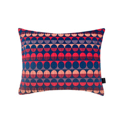 Millie Rectangle Cushion with a geometric pattern of red and blue circles and semicircles, by Margo Selby