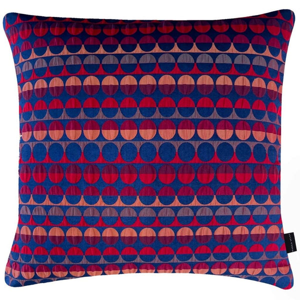 Millie Square Cushion with a geometric pattern of red and blue circles and semicircles, by Margo Selby
