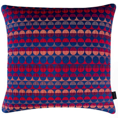 Millie Square Cushion with a geometric pattern of red and blue circles and semicircles, by Margo Selby