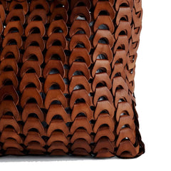 Close up of Dragon Diffusion NS Link Tote Tan crossbody handbag with a textured, chain-like pattern made from recycled buffalo leather.
