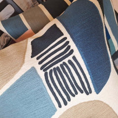 Neptu Embroidered Cushion showcasing vibrant colors and intricate stitching details.