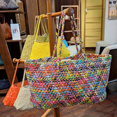 Dragon Diffusion multicolored geometric-patterned handbag with a handle.