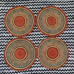 Baba Tree Handwoven Round Placemat 00015 with black, orange and natural pattern made of elephant grass in Ghana