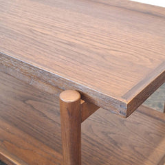 Close up of teak serving cart with wheels 
