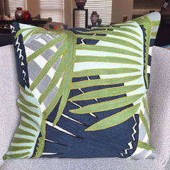 Pinna Embroidered Cushion 45x45cm with vibrant green and navy leaf pattern on soft cotton cover.