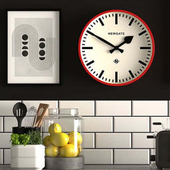 Newgate Railway Wall Clock Red on a kitchen wall.
