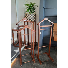 walnut wood Ric Coat Hanger Tall with a curved silhouette, featuring two hanging rails and a base for placing shoes or small items.