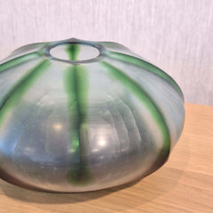 Rockpool Vase 10cm with a rounded, dome-like shape, featuring a translucent white body with green ribbed accents 