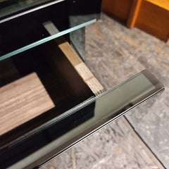 close up of a black modern Roma Nightstand with two deep drawers, made of mirror glass on MDF.
