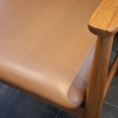 Close-up of tan leather cushion on Roxita Armchair Danish Cord Natural