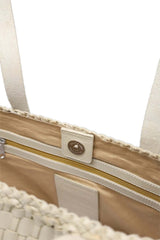 Close-up of a Dragon Diffusion Salvage Pearl woven leather bag with a zipper and a button