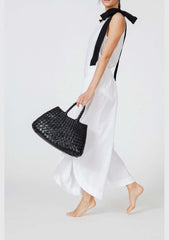 Dragon Diffusion Santa Croce Small Black with asymmetric leather straps and a woven basket-like design.