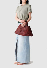 Dragon Diffusion Santa Croce Small Bordo with asymmetric leather straps and a woven basket-like design.