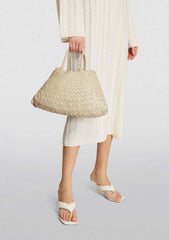 Dragon Diffusion Santa Croce Small Pearl with asymmetric leather straps and a woven basket-like design.
