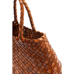 Dragon Diffusion Santa Croce Small Tan handbag with asymmetric leather straps and a woven basket-like design.