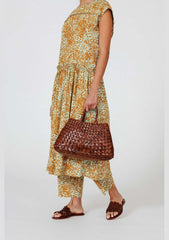 Dragon Diffusion Santa Croce Small Tan handbag with asymmetric leather straps and a woven basket-like design.