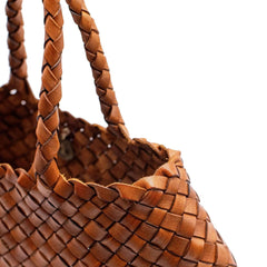 Dragon Diffusion Santa Croce Small Tan handbag with asymmetric leather straps and a woven basket-like design.