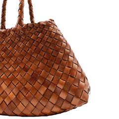 Dragon Diffusion Santa Croce Small Tan handbag with asymmetric leather straps and a woven basket-like design.